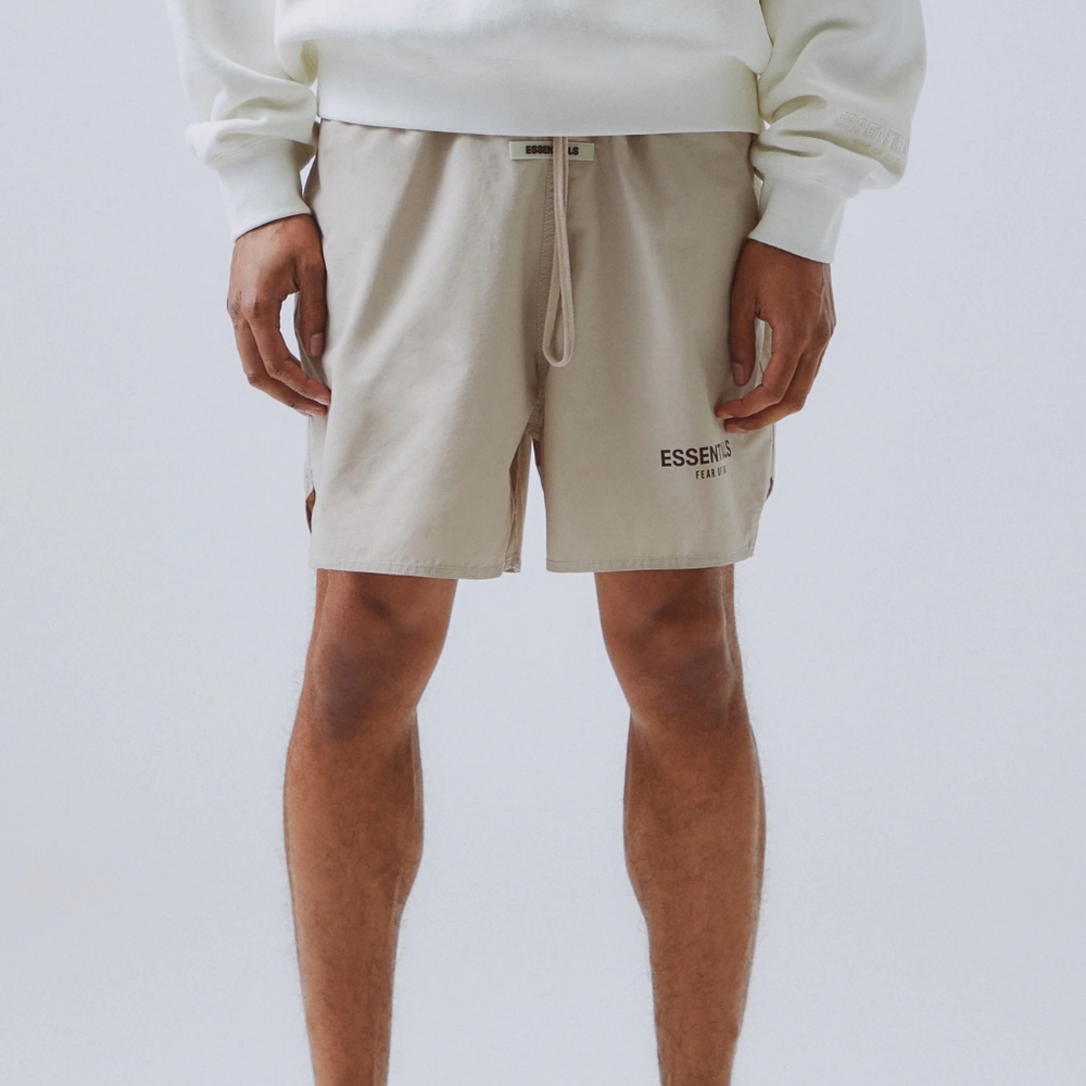 Fear Of God Essentials Shorts in white and cream